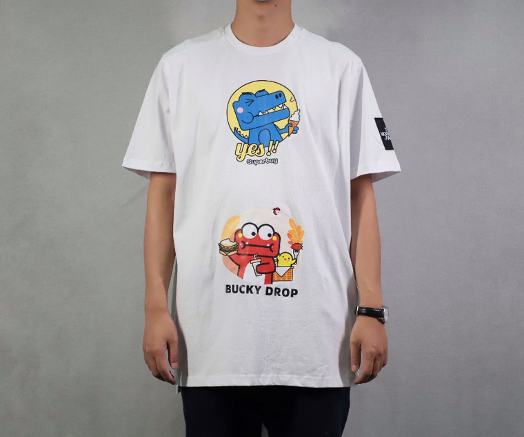 A live model wearing a printed white t-shirt, photographed from the front
